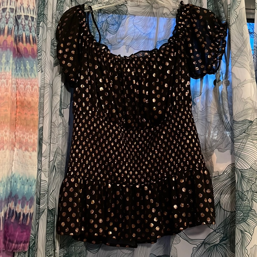 A Venus black with gold polkadots off the shoulder or on the shoulder blouse